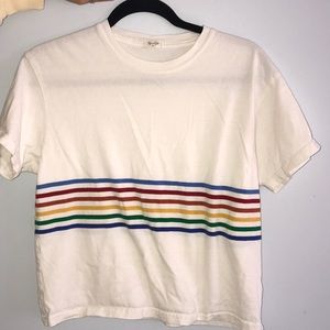 White t-shirt with rainbow stripes.